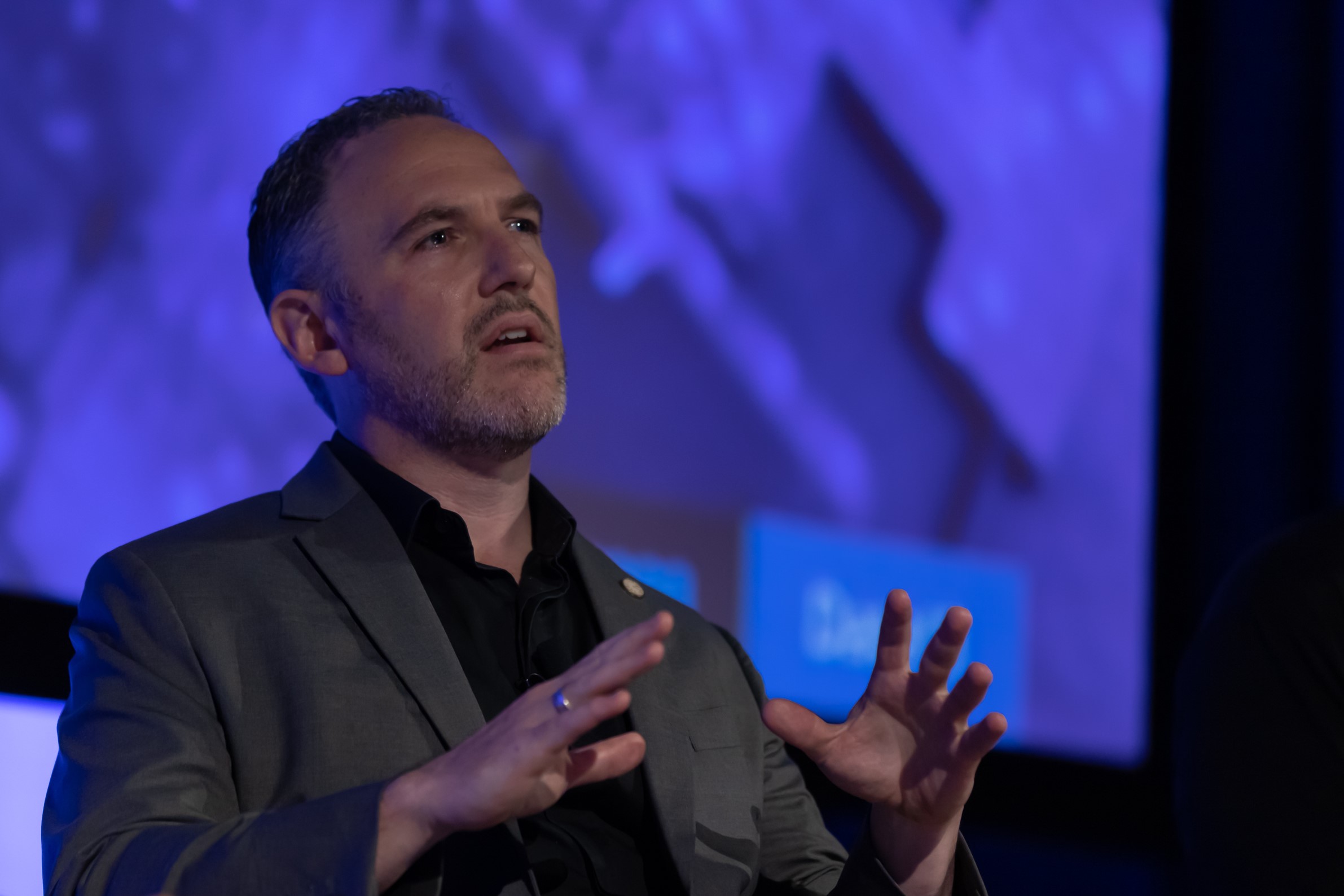 Photo of Graham Robinson speaking at JuiceIT 2023 in Brisbane